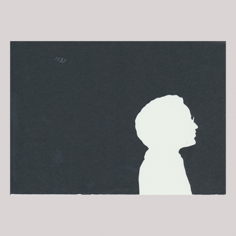 
        Silhouette with man looking right and wearing glasses